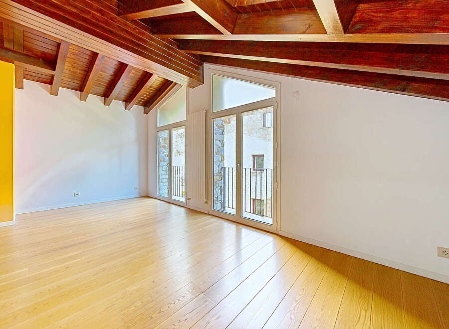 Experience the charm of this attic apartment, featuring a stunning exposed wooden beam ceiling that adds warmth and character.