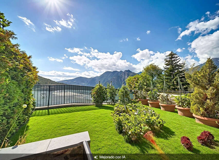 Enjoy breathtaking mountain and lake views from this stunning property's meticulously manicured lawn and garden.
