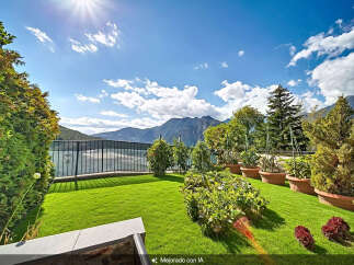 Enjoy breathtaking mountain and lake views from this stunning property's meticulously manicured lawn and garden.