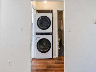 Discover convenience with this stacked LG washer and dryer unit, perfect for maximizing space in your home.