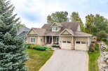 Discover this charming home featuring a welcoming front porch, a spacious two-car garage, and beautiful landscaping.