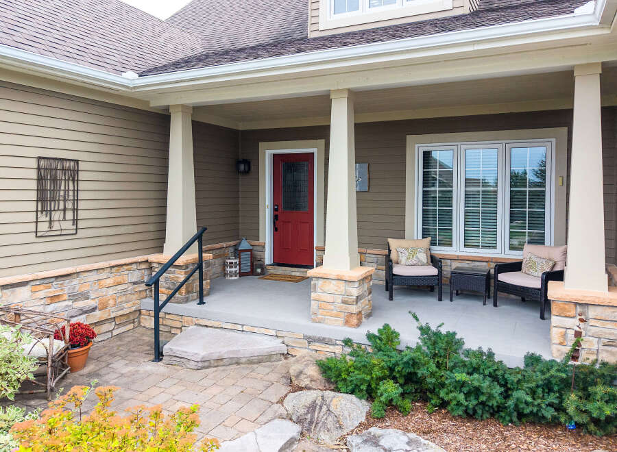 Welcome guests to this charming home with a welcoming covered porch.