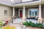 Welcome guests to this charming home with a welcoming covered porch.