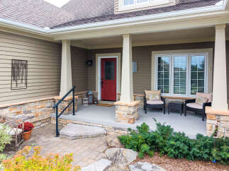 Welcome guests to this charming home with a welcoming covered porch.
