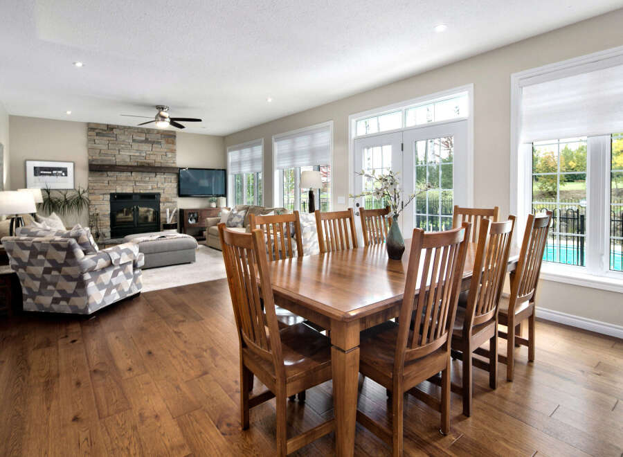 Experience elegant open-concept living with this spacious dining and living area, perfect for entertaining.