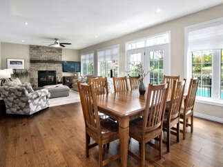 Experience elegant open-concept living with this spacious dining and living area, perfect for entertaining.