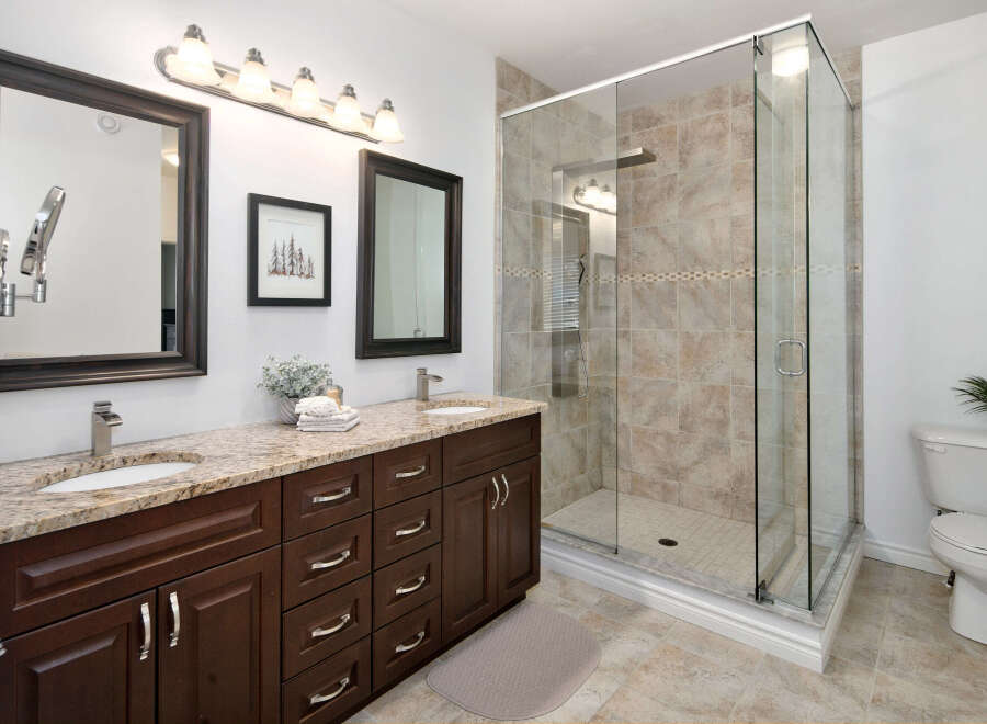 Experience luxury in this stunning bathroom featuring a spacious walk-in shower with elegant tilework.