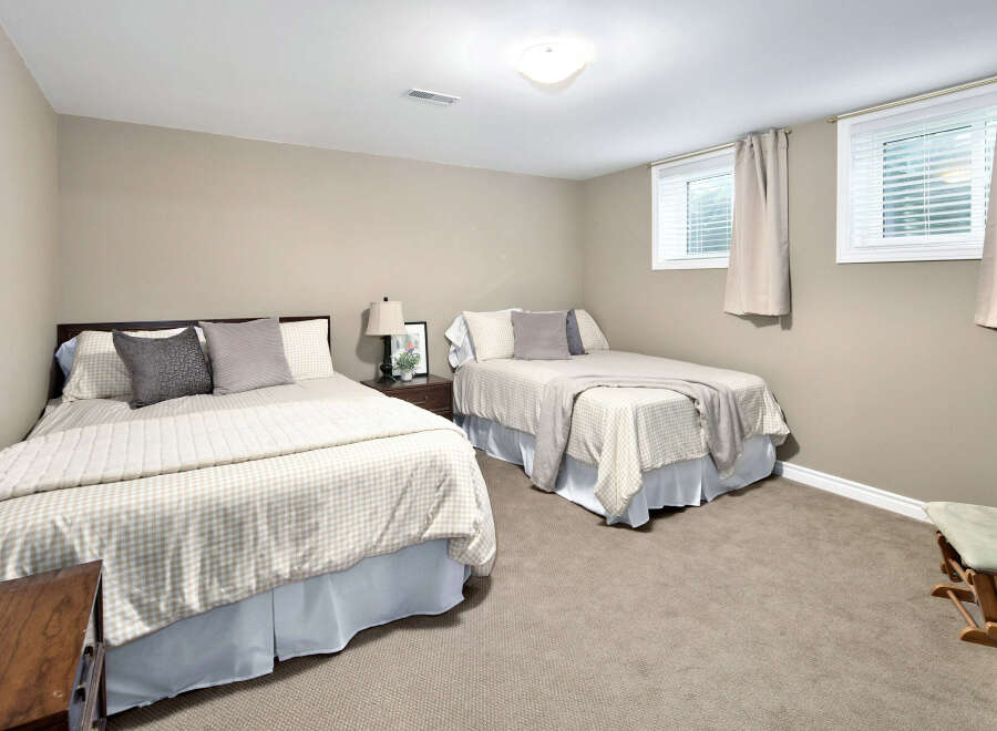 This inviting bedroom features two comfortable beds, perfect for accommodating family or guests.