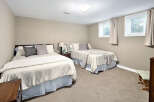 This inviting bedroom features two comfortable beds, perfect for accommodating family or guests.