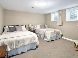 This inviting bedroom features two comfortable beds, perfect for accommodating family or guests.