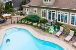 Enjoy ultimate relaxation in this backyard oasis, featuring a sparkling swimming pool and a luxurious hot tub perfect for unwinding.