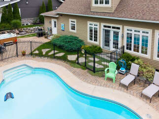 Enjoy ultimate relaxation in this backyard oasis, featuring a sparkling swimming pool and a luxurious hot tub perfect for unwinding.