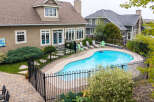 Escape to your private oasis with this stunning backyard featuring a sparkling kidney-shaped pool, perfect for summer relaxation and entertaining.