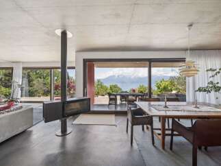 Experience breathtaking mountain and lake views from this stunning modern living space.