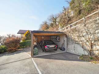 Discover this charming property featuring a spacious carport, perfect for protecting your vehicles from the elements.
