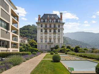 Experience luxury living in this stunning property featuring a grand, historic building complemented by modern architecture.