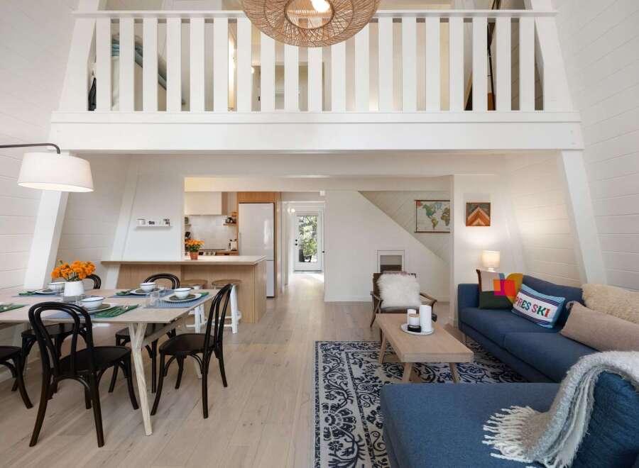 Experience the ultimate cozy retreat in this charming A-frame cabin, featuring a bright and airy open-concept living space.