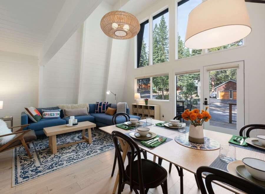 Experience the ultimate mountain retreat in this stunning A-frame home, boasting soaring vaulted ceilings and an abundance of natural light pouring through expansive windows.