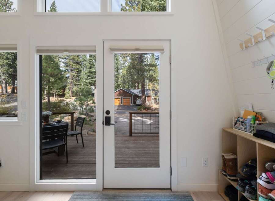 Step into this inviting entryway, bathed in natural light from expansive windows.