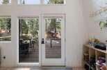 Step into this inviting entryway, bathed in natural light from expansive windows.