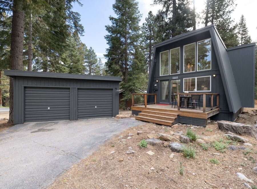 Discover this stunning A-frame home nestled among tall pine trees.