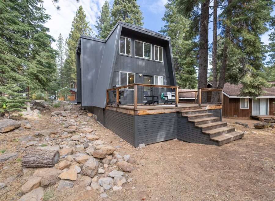 Embrace the mountain lifestyle in this unique A-frame home nestled amongst tall pine trees.