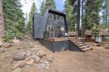 Embrace the mountain lifestyle in this unique A-frame home nestled amongst tall pine trees.