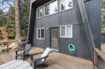 Enjoy outdoor living on this spacious wooden deck, perfect for entertaining or relaxing.