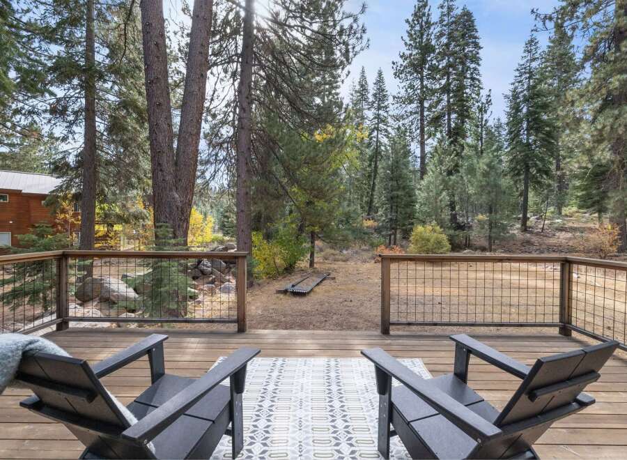 Enjoy the serene mountain lifestyle from this spacious deck, perfect for morning coffee or evening relaxation.