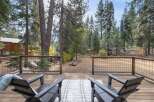 Enjoy the serene mountain lifestyle from this spacious deck, perfect for morning coffee or evening relaxation.