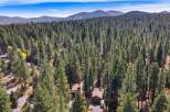 Nestled amidst a dense forest of towering pine trees, this property offers a serene and private retreat.