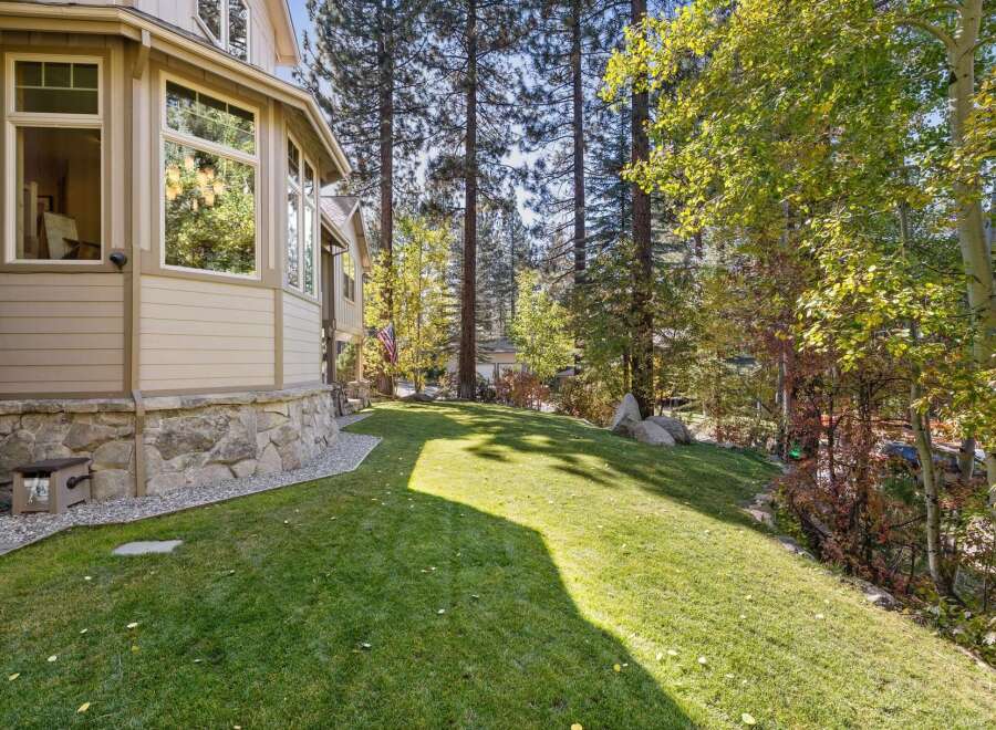 This stunning property boasts a beautifully maintained lawn, perfect for outdoor activities and relaxation.