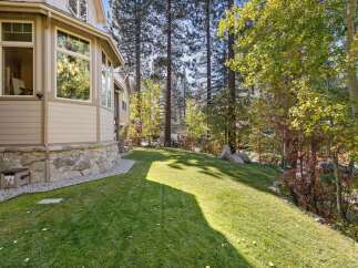 This stunning property boasts a beautifully maintained lawn, perfect for outdoor activities and relaxation.