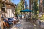 Enjoy outdoor living at its finest with this inviting patio space, featuring a luxurious hot tub perfect for relaxation and a comfortable seating area for gatherings.