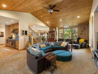 Experience luxurious living in this spacious open-concept home, featuring a gourmet kitchen with custom cabinetry and a large island perfect for entertaining.