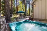 Relax and unwind in this luxurious hot tub, perfectly situated amidst a serene forest setting.