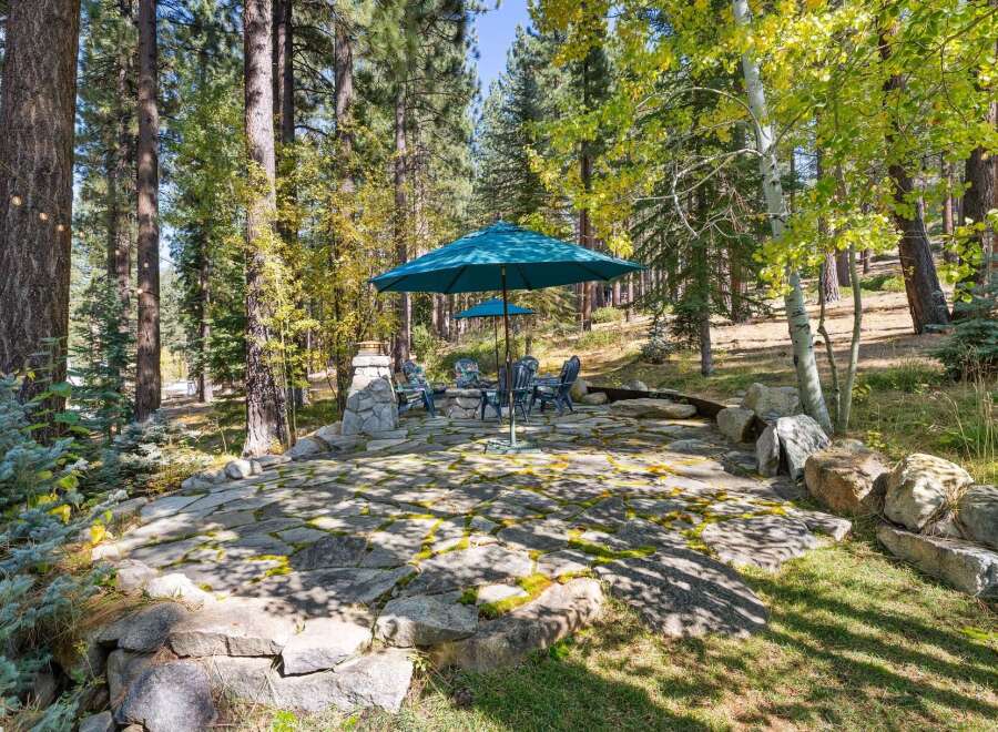 Enjoy the serene outdoors with this charming patio area, perfect for relaxation and entertaining.