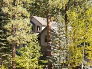 Nestled amongst mature pine and aspen trees, this stunning home offers a serene mountain retreat.