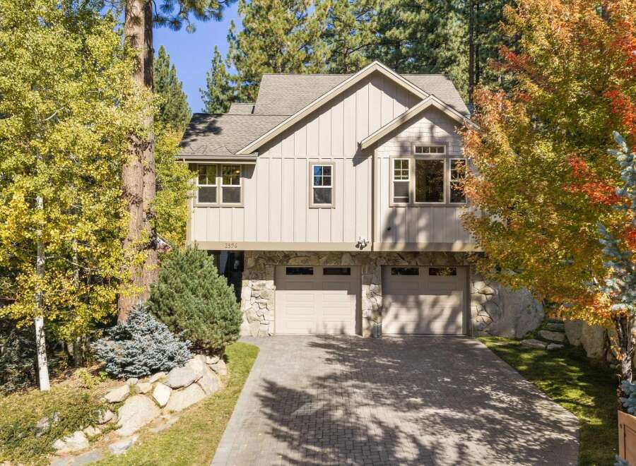 Nestled amidst vibrant autumn foliage, this stunning home offers a picturesque setting.