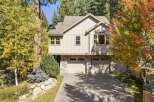 Nestled amidst vibrant autumn foliage, this stunning home offers a picturesque setting.