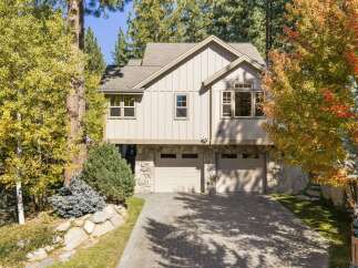 Nestled amidst vibrant autumn foliage, this stunning home offers a picturesque setting.