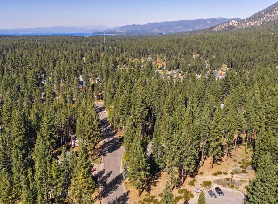 Discover this stunning property nestled amidst a dense forest of mature pine trees, offering unparalleled privacy and natural beauty.