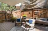 Enjoy outdoor living on this charming deck, perfect for relaxing or entertaining.