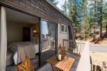Step outside your cozy bedroom onto a private balcony, perfect for enjoying the serene mountain air.