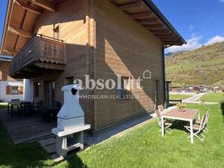 Experience alpine living in this charming wooden house, perfect for a family getaway.