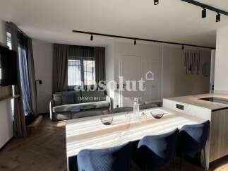 Experience modern living in this beautifully appointed apartment, featuring an open-plan layout that seamlessly integrates a stylish kitchen with a spacious dining and living area.