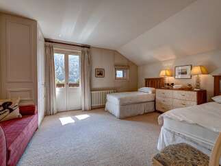 This charming bedroom features two twin beds, perfect for accommodating guests or family.