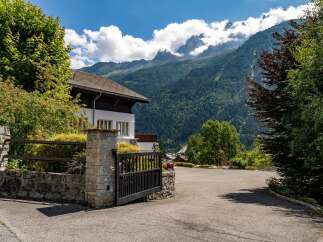 Nestled against a backdrop of majestic mountains, this property offers a serene escape.