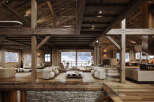 Experience luxurious mountain living in this stunning chalet, featuring a spacious open-plan living area with exposed wooden beams and a cozy fireplace.
