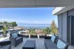 Enjoy breathtaking lake and mountain views from this stunning modern balcony.